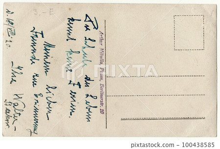 Back of a vintage photo - used postcard. Rich stain and paper details. Can be used as background. Image contains handwriting. 100438585