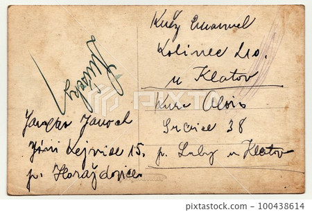 Back of a vintage photo - used postcard. Rich stain and paper details. Can be used as background. Postcard contains handwriting. Back of a vintage photo - used postcard. Rich stain and paper details. Can be used as background. Postcard contains handwriting. 100438614