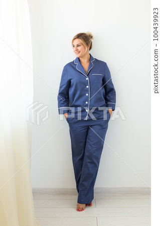 Fun minded woman wear pajama use rest relax spend time in living room lounge home in own room hotel wake up Fun minded woman wear pajama use rest relax spend time in living room lounge home in own room hotel wake up 100439923