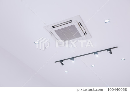 Ceiling type 4 directions air vent system air conditioner unit in a modern office building and coffeeshop Ceiling type 4 directions air vent system air conditioner unit in a modern office building and coffeeshop 100440068