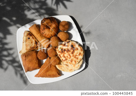 Sri Lankan different street food, vegetable and coconut roti, cutlets, snack. Sri Lankan different street food, vegetable and coconut roti, cutlets, snack. 100443845