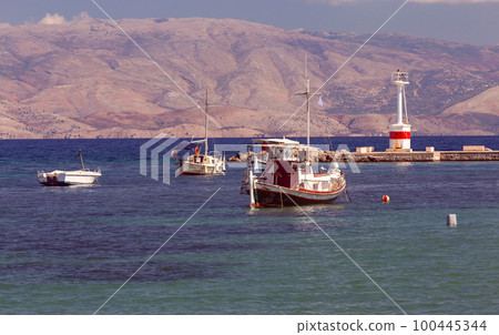 Kerkyra. Greece. View of the coastline and ships on a sunny day. 100445344