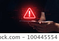 Caution concept. The person is holding a tablet with a sign. 100445554
