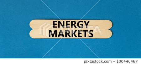 Energy markets symbol. Concept words Energy markets on wooden sticks. Beautiful blue table blue background. Business energy markets concept. Copy space. 100446467