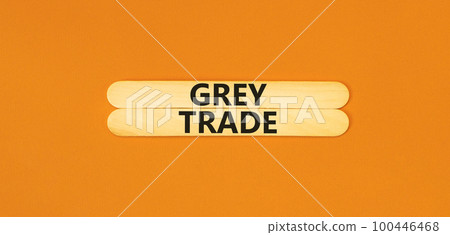 Grey trade symbol. Concept words Grey trade on wooden sticks. Beautiful orange table orange background. Business grey trade concept. Copy space. 100446468