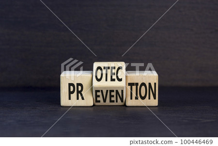 Protection and prevention symbol. Concept word Protection Prevention on wooden cubes. Beautiful black table black background. Business and rotection and prevention concept. Copy space. 100446469