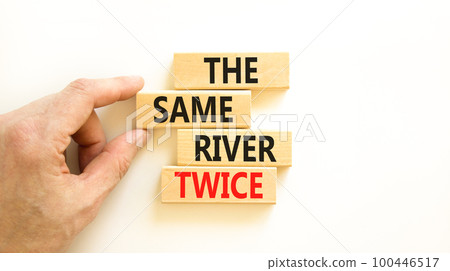 The same river twice symbol. Concept words The same river twice on wooden block. Beautiful white table white background. Motivational business the same river twice concept. Copy space. The same river twice symbol. Concept words The same river twice on wooden block. Beautiful white table white background. Motivational business the same river twice concept. Copy space. 100446517