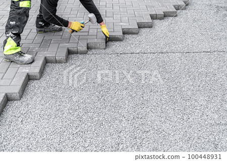 rubber hammer for adjusting the lock paving on the sidewalk 100448931
