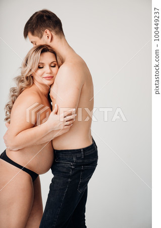 a passionate man and pregnan woman topless in black underwear a passionate man and pregnan woman topless in black underwear 100449237