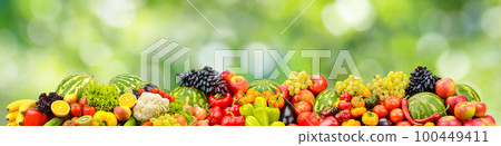 Fresh healthy vegetables, fruits, berries on green background. 100449411