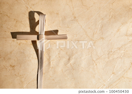 Palm sunday background. Cross from palm leaves on vintage background. Palm sunday background. Cross from palm leaves on vintage background. 100450430