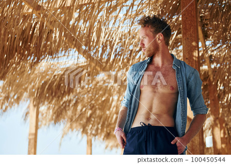 Young european man have vacation and enjoying free time on the beach of sea Young european man have vacation and enjoying free time on the beach of sea 100450544