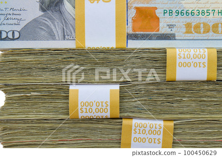 Close up of 4 straps of 100 dollar bills totaling ten thousand US dollars each stacked on top of each other, side view. High quality photo Close up of 4 straps of 100 dollar bills totaling ten thousand US dollars each stacked on top of each other, side view. High quality photo 100450629