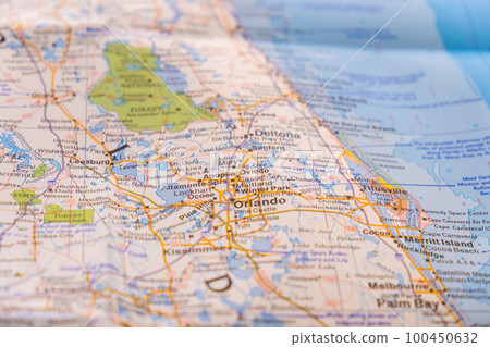 Close up detail of colorful map focusing on Orlando, Florida through selective focus, background blur. High quality photo 100450632
