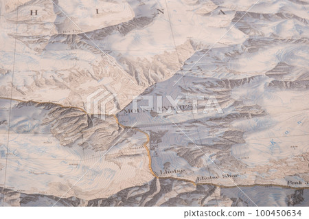 Selective focus close up of map detail of Mt. Everest topographical map showing contour lines, elevation. High quality photo 100450634