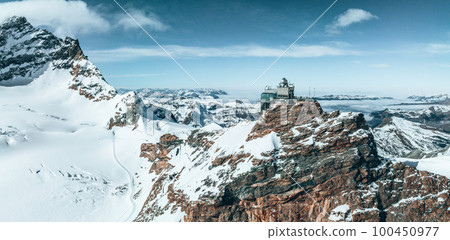 Aerial panorama view of the Sphinx Observatory on Jungfraujoch - Top of Europe, one of the highest observatories in the world located at the Jungfrau railway station, Bernese Oberland, Switzerland. 100450977