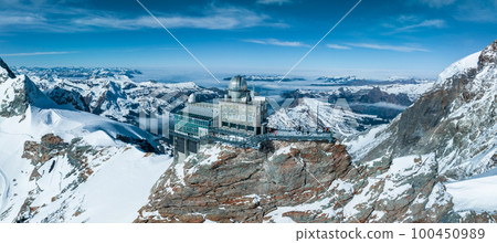 Aerial panorama view of the Sphinx Observatory on Jungfraujoch - Top of Europe, one of the highest observatories in the world located at the Jungfrau railway station, Bernese Oberland, Switzerland. Aerial panorama view of the Sphinx Observatory on Jungfraujoch - Top of Europe, one of the highest observatories in the world located at the Jungfrau railway station, Bernese Oberland, Switzerland. 100450989