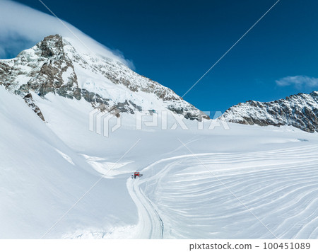 Aerial view of Great Aletsch Glacier, the largest glacier in the Alps and UNESCO heritage, in Canton of Valais, Switzerland. Aletsch glacier - ice panorama landscape in Alps of Switzerland, Europe Aerial view of Great Aletsch Glacier, the largest glacier in the Alps and UNESCO heritage, in Canton of Valais, Switzerland. Aletsch glacier - ice panorama landscape in Alps of Switzerland, Europe 100451089