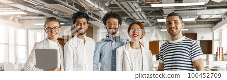 Diverse group of colleagues enjoying working together in an office. Teamwork concept 100452709