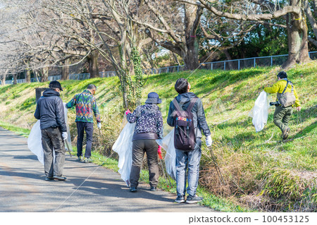 Environmental protection activities: People picking up trash Environmental protection activities: People picking up trash 100453125