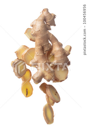 Ginger fall fly in mid air, fresh vegetable spice ginger falling. Organic fresh herbal ginger root head cut chop slice, close up texture. White background isolated freeze motion high speed shutter 100456956