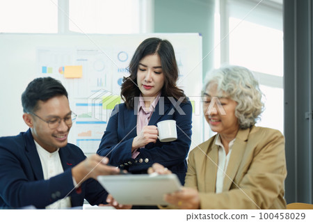 Asian entrepreneurs and business people meeting in a conference room in business planning, financial budget and investment risk assessment to analyze customer groups to increase company growth. Asian entrepreneurs and business people meeting in a conference room in business planning, financial budget and investment risk assessment to analyze customer groups to increase company growth. 100458029