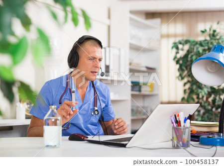 Doctor consulting patient online via laptop indoors. Telemedicine concept Doctor consulting patient online via laptop indoors. Telemedicine concept 100458137