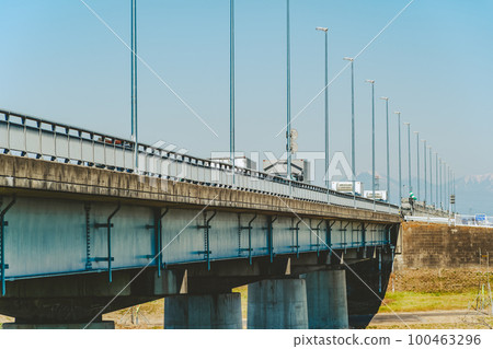 Bridges, distribution trucks, blue sky in early spring and Mt. 100463296