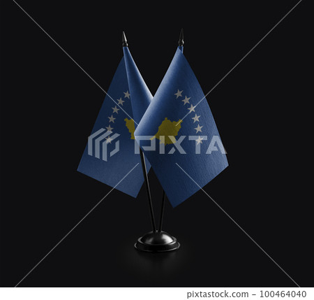Small national flags of the Kosovo on a black background 100464040