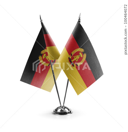 Small national flags of the DDR on a white background 100464072