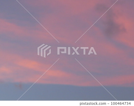a Dramatic sunrise, sunset pink violet sky with clouds 100464734