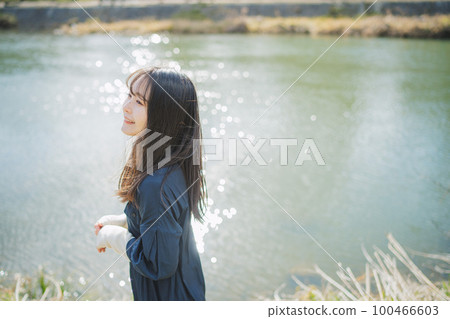 girl standing by the river girl standing by the river 100466603