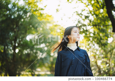 woman surrounded by backlight woman surrounded by backlight 100466774