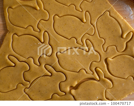 Close-up kneading ginger dough and carving figurines Close-up kneading ginger dough and carving figurines 100470717