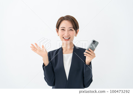 Business women smartphones are surprised Business women smartphones are surprised 100473292