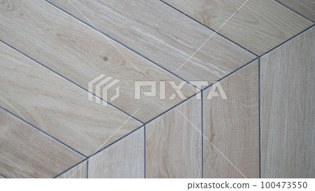 Wooden laminate on floor in shape of tree closeup Wooden laminate on floor in shape of tree closeup 100473550