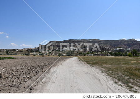 Fields and sandy paths next to Cavusin in Cappadocia, Turkey 100476805