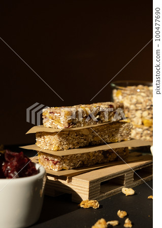 Homemade Granola energy bar. Variety of homemade protein granola breakfast bars ingredients nuts, raisins dried cherries and chocolate. Healthy nutrition eating Gluten free cereal dieting snack super Homemade Granola energy bar. Variety of homemade protein granola breakfast bars ingredients nuts, raisins dried cherries and chocolate. Healthy nutrition eating Gluten free cereal dieting snack super 100477690
