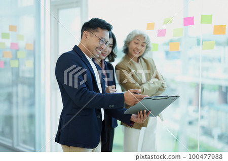 Asian entrepreneurs and business people meeting in a conference room in business planning, financial budget and investment risk assessment to analyze customer groups to increase company growth. Asian entrepreneurs and business people meeting in a conference room in business planning, financial budget and investment risk assessment to analyze customer groups to increase company growth. 100477988