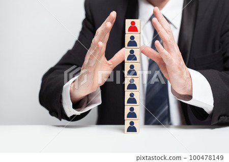 Wooden blocks people icons and businessman hands, leadership, carieer, business concept 100478149