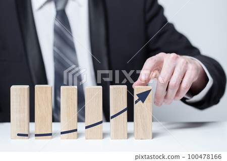 Wooden blocks with black arrow icons, business profit growth success concept 100478166