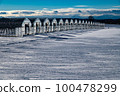 A group of vinyl houses lined up in the snowy fields of Hokkaido 100478299