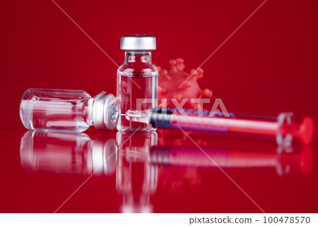 Close up medical syringe with a vaccine 100478570