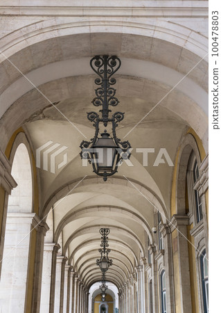 Light vaulted corridor with hanging lamps of Ribeira Palace 100478803