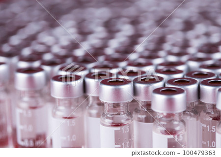 Ampoules with covid 19 vaccine 100479363