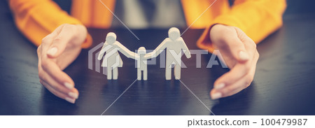 Figurine of the family surrounding by woman's hands. Figurine of the family surrounding by woman's hands. 100479987