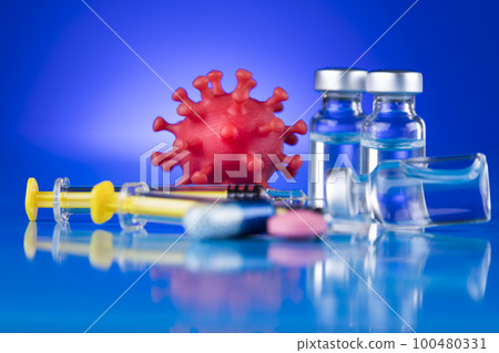Close up medical syringe with a vaccine 100480331