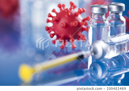 Close up medical syringe with a vaccine Close up medical syringe with a vaccine 100481469