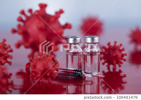Close up medical syringe with a vaccine 100481476