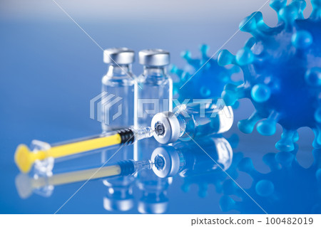 Close up medical syringe with a vaccine 100482019